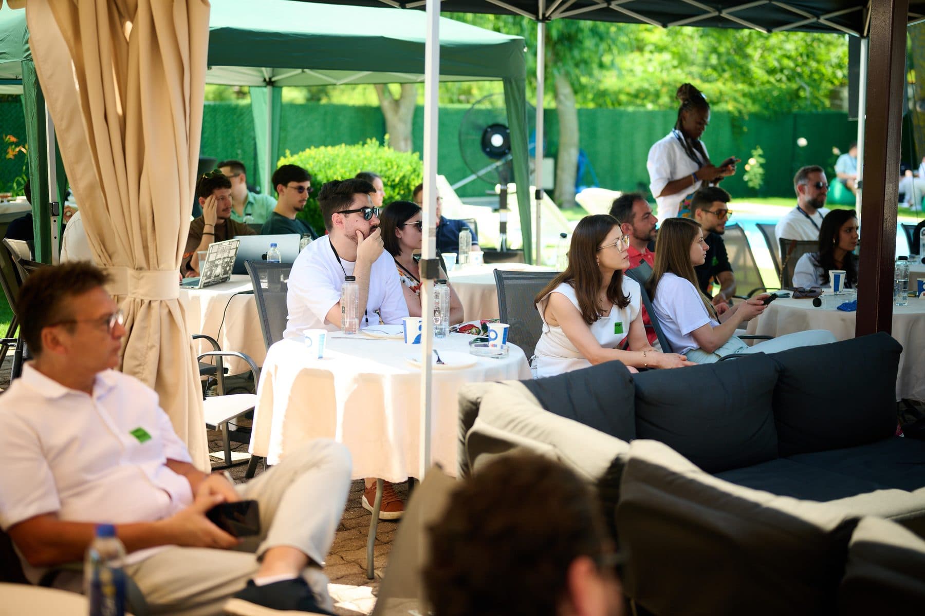 A session in the garden lounge — AI House Bucharest, June 2026